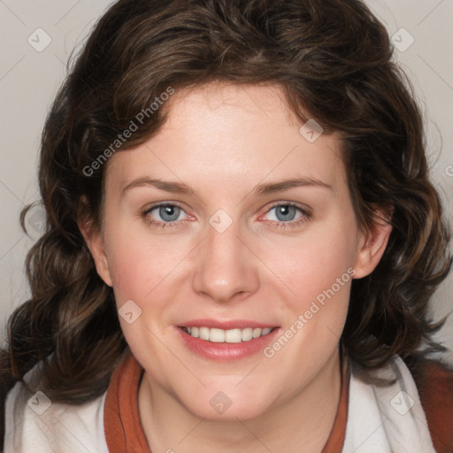 Joyful white young-adult female with medium  brown hair and blue eyes