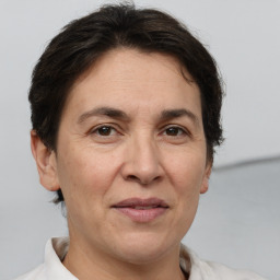 Joyful white adult female with short  brown hair and brown eyes