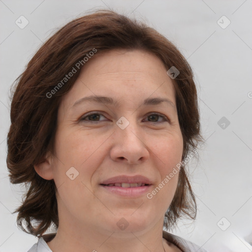 Joyful white adult female with medium  brown hair and brown eyes