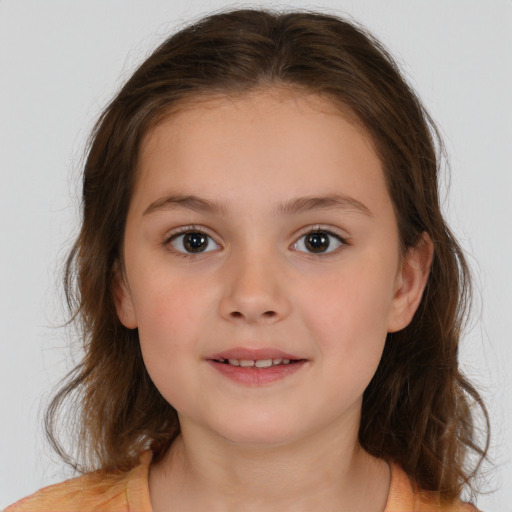 Joyful white child female with medium  brown hair and brown eyes