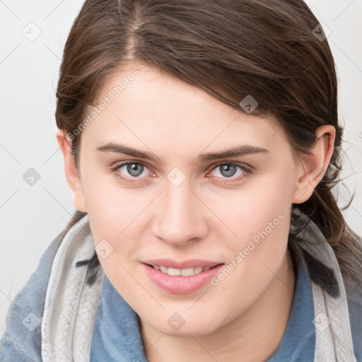 Joyful white young-adult female with medium  brown hair and blue eyes