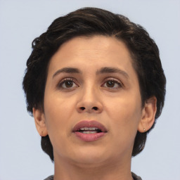 Joyful white adult female with short  brown hair and brown eyes