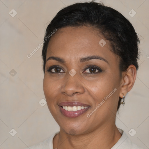 Joyful black young-adult female with short  brown hair and brown eyes