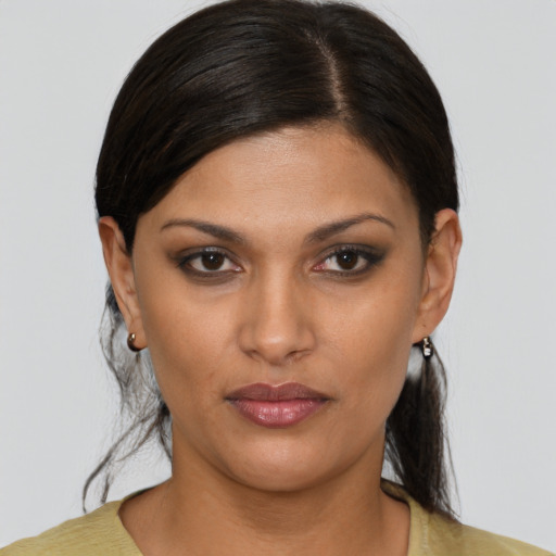 Neutral latino young-adult female with medium  brown hair and brown eyes