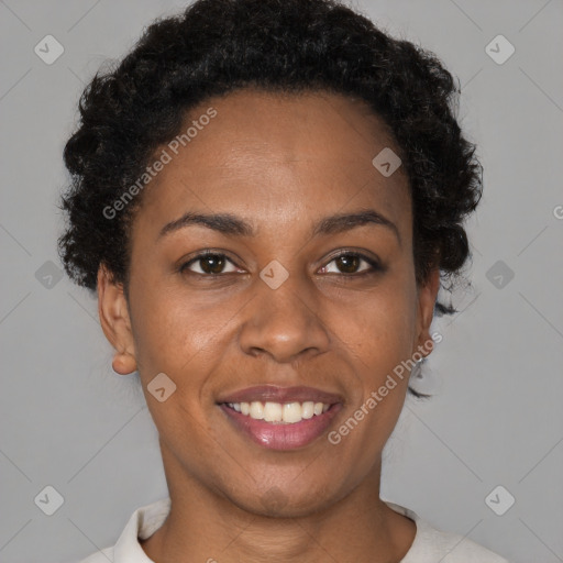 Joyful black young-adult female with short  brown hair and brown eyes