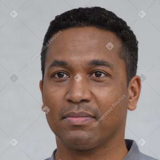 Neutral black young-adult male with short  black hair and brown eyes