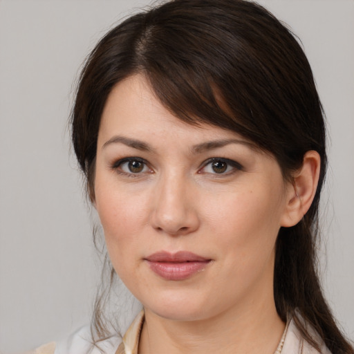 Joyful white young-adult female with medium  brown hair and brown eyes