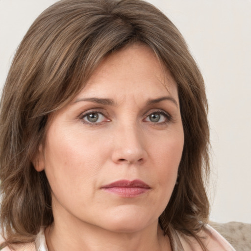 Neutral white young-adult female with medium  brown hair and grey eyes