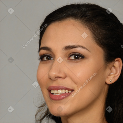 Joyful white young-adult female with long  brown hair and brown eyes