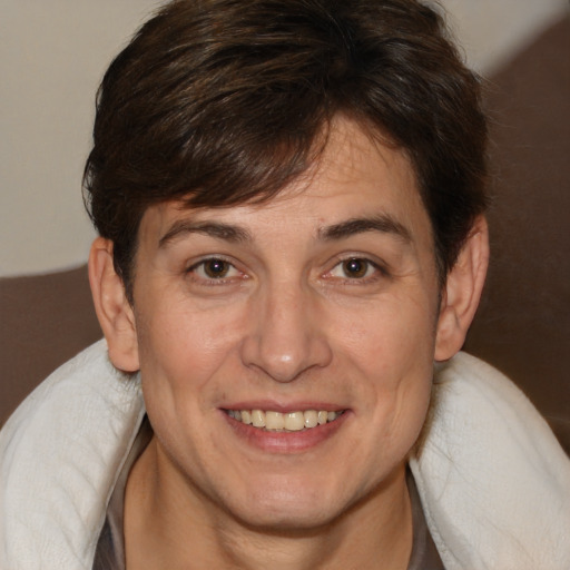 Joyful white adult female with medium  brown hair and brown eyes