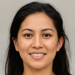 Joyful white young-adult female with long  brown hair and brown eyes