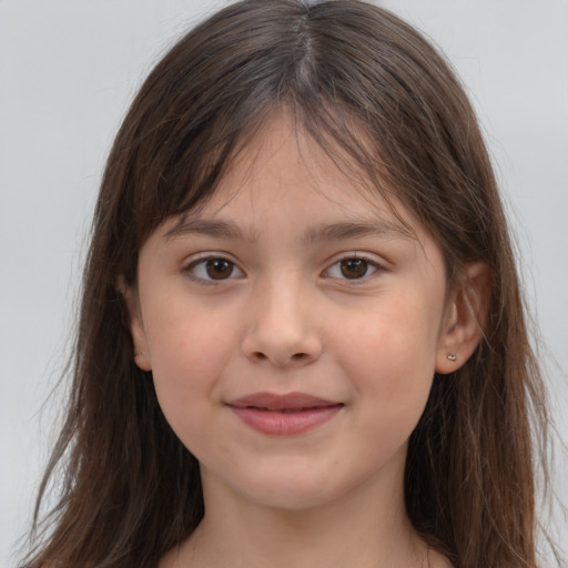 Joyful white child female with long  brown hair and brown eyes