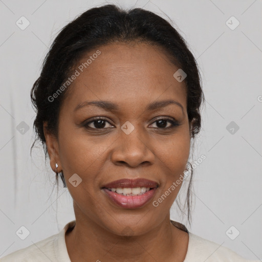 Joyful black adult female with medium  brown hair and brown eyes