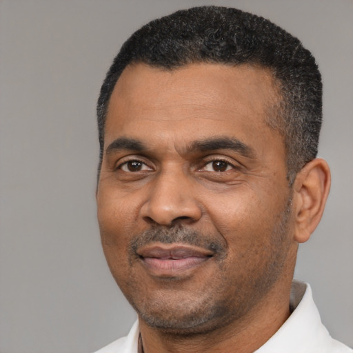 Neutral black adult male with short  black hair and brown eyes