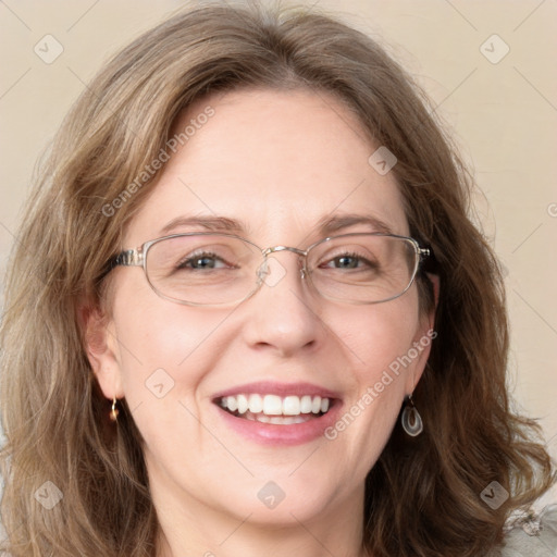 Joyful white adult female with medium  brown hair and blue eyes