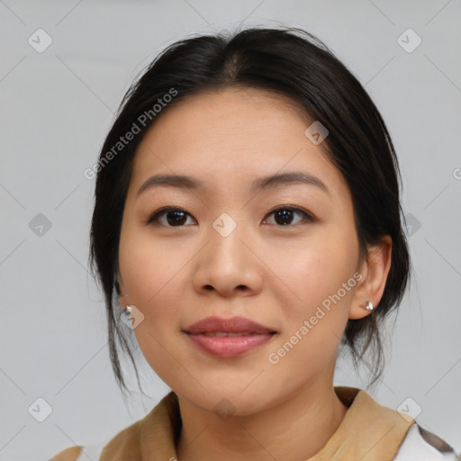 Joyful asian young-adult female with medium  brown hair and brown eyes