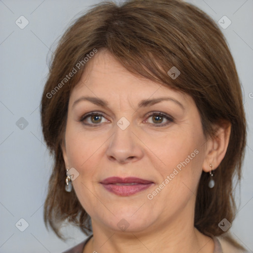 Joyful white adult female with medium  brown hair and brown eyes