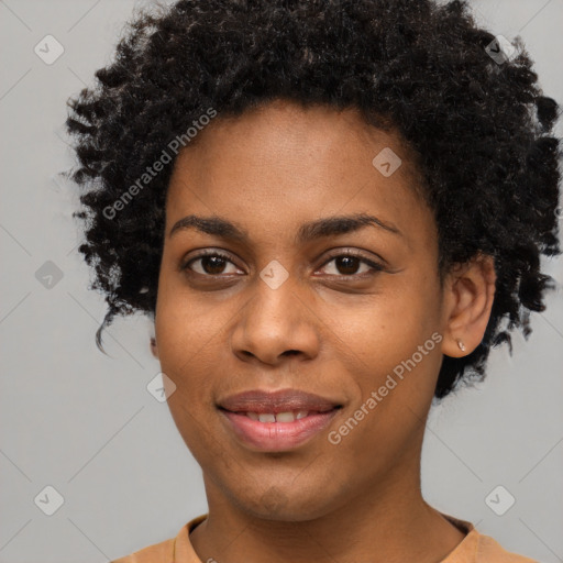 Joyful black young-adult female with short  black hair and brown eyes