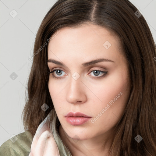 Neutral white young-adult female with long  brown hair and brown eyes