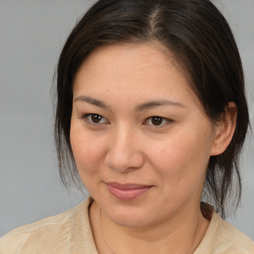 Joyful white young-adult female with medium  brown hair and brown eyes