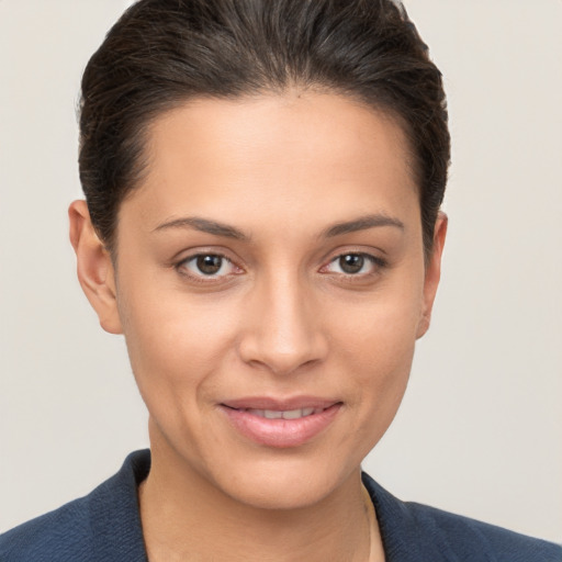 Joyful white young-adult female with short  brown hair and brown eyes