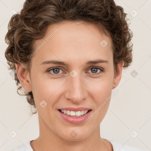 Joyful white young-adult female with medium  brown hair and green eyes