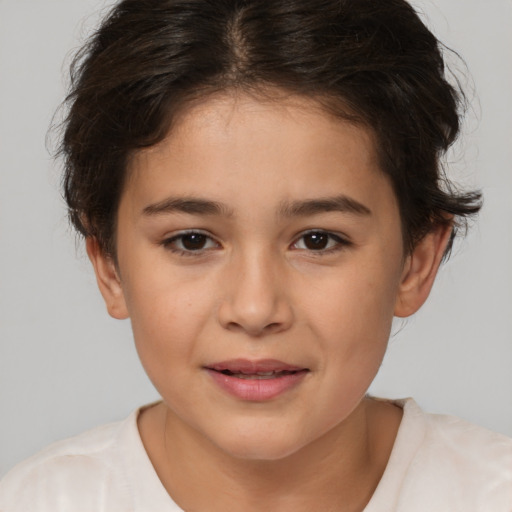 Joyful white child female with short  brown hair and brown eyes