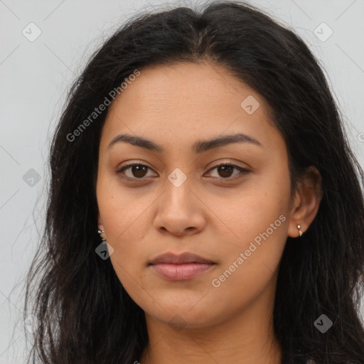 Joyful latino young-adult female with long  brown hair and brown eyes