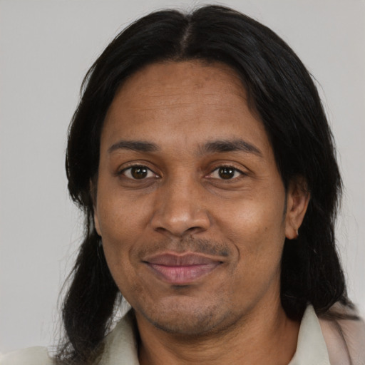 Joyful black adult female with short  black hair and brown eyes