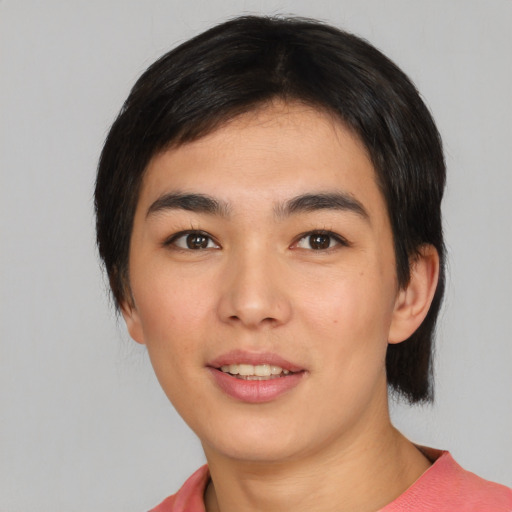 Joyful asian young-adult female with medium  black hair and brown eyes