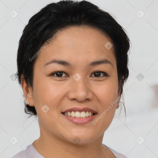 Joyful asian young-adult female with short  black hair and brown eyes