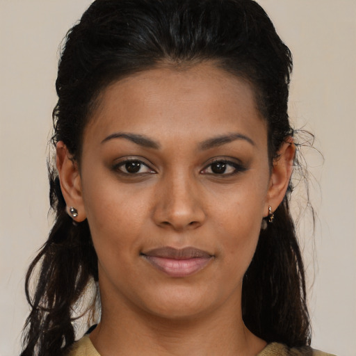 Joyful black young-adult female with medium  brown hair and brown eyes