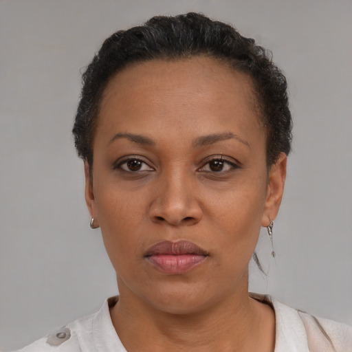 Neutral black adult female with short  brown hair and brown eyes