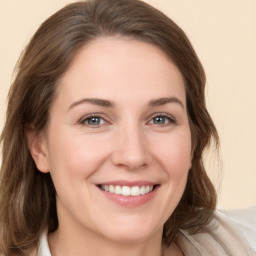 Joyful white young-adult female with medium  brown hair and brown eyes