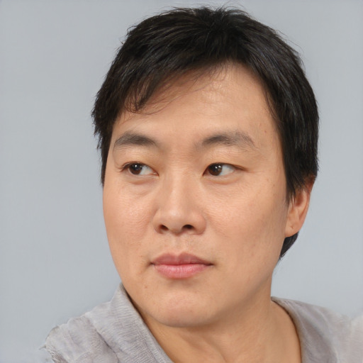 Neutral asian young-adult male with short  black hair and brown eyes
