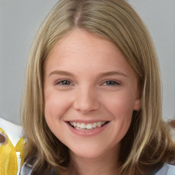 Joyful white child female with medium  brown hair and brown eyes