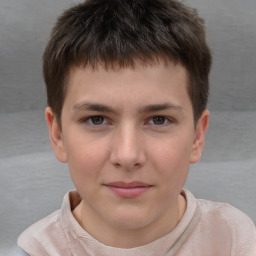 Joyful white child male with short  brown hair and brown eyes