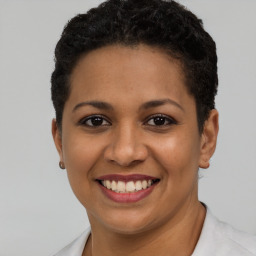 Joyful latino young-adult female with short  brown hair and brown eyes