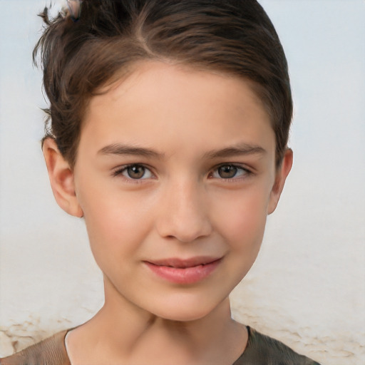 Joyful white child female with short  brown hair and brown eyes