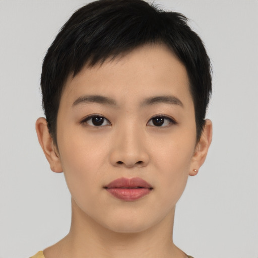 Joyful asian young-adult female with short  brown hair and brown eyes