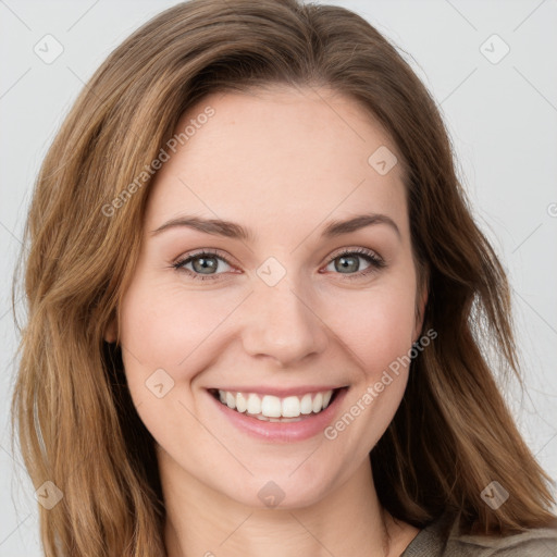 Joyful white young-adult female with long  brown hair and green eyes