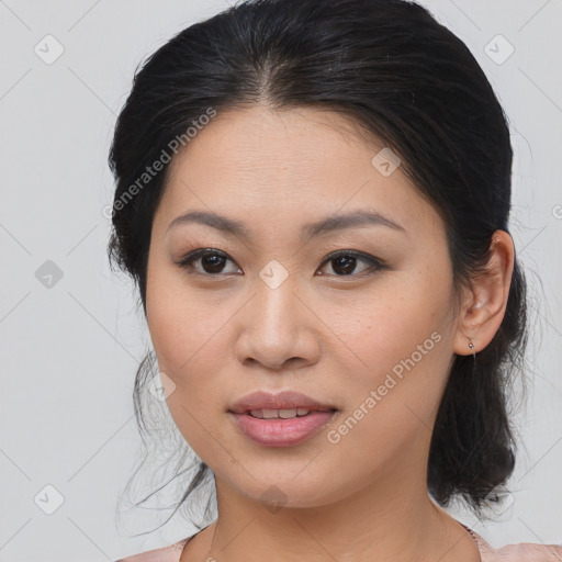 Joyful asian young-adult female with medium  brown hair and brown eyes