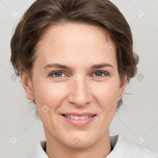 Joyful white young-adult female with short  brown hair and grey eyes