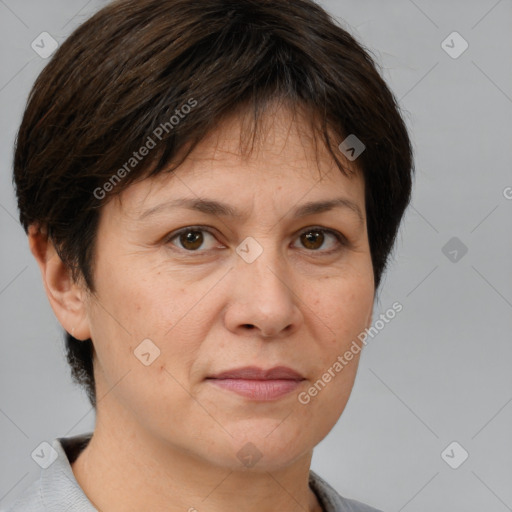 Joyful white adult female with short  brown hair and brown eyes