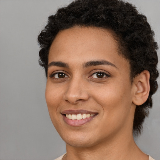 Joyful latino young-adult female with short  brown hair and brown eyes