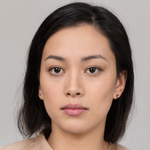 Neutral asian young-adult female with medium  black hair and brown eyes