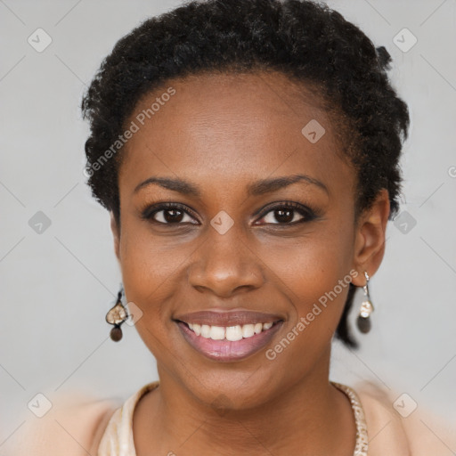 Joyful black young-adult female with short  brown hair and brown eyes