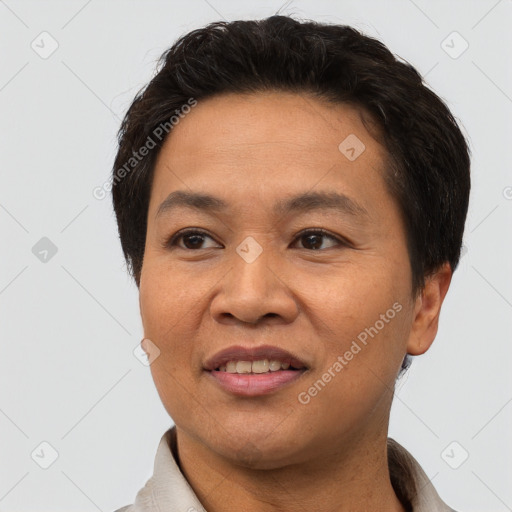 Joyful asian adult male with short  brown hair and brown eyes