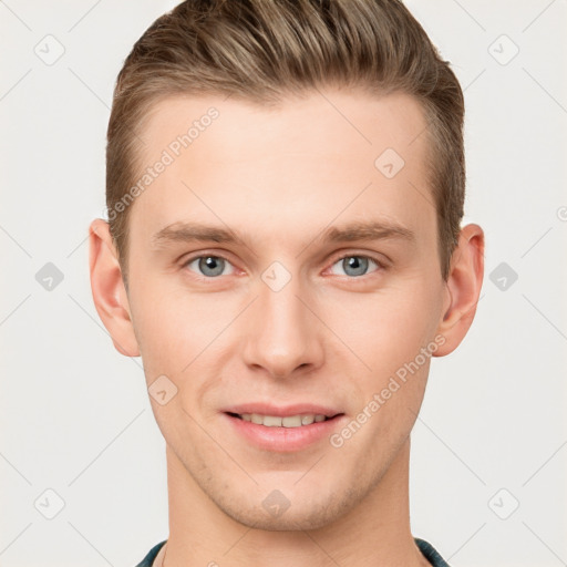 Joyful white young-adult male with short  brown hair and grey eyes