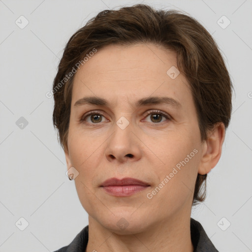 Joyful white adult female with short  brown hair and grey eyes